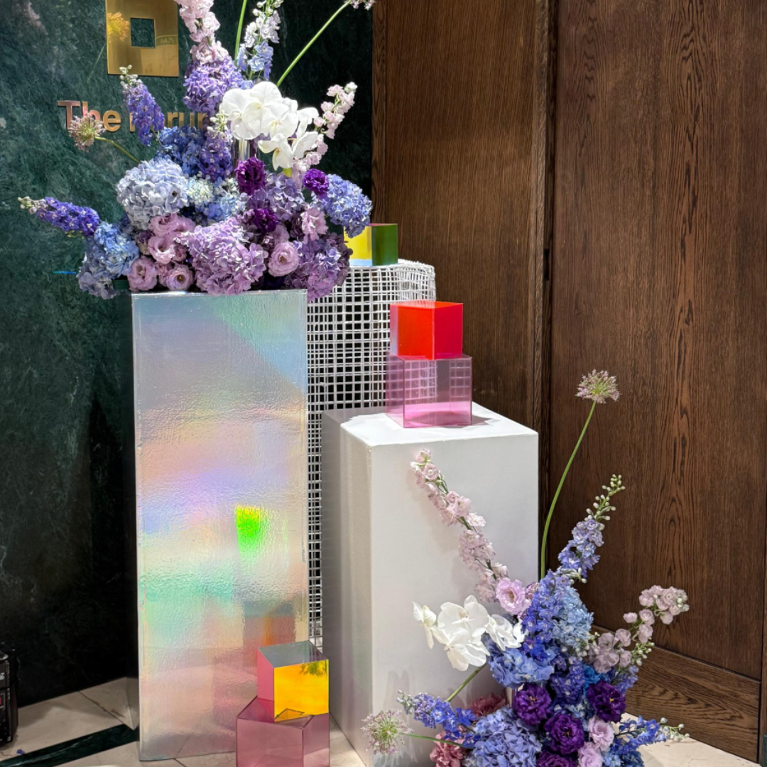 Step into the future. ✨
For the Samsung Galaxy AI launch at The Forum Hyde Park, stylist Mel curated a sleek, tech-forward palette of violet, blue, grey, white, and black.
We loved experimenting with unique textures for this one - from our custom furniture selections to those eye-catching holographic vinyls and perspex squiggly vases. It was all about creating a space as smart and polished as the tech itself.
A special thanks to our creative partners:
🌸 Florals: @Shopbotanicus
🎨 Perspex Decor: @WeDoPro
✨ Vinyls: @JoziCustoms
#UrbantonicJHB #SamsungGalaxyAI #ProductLaunch #EventStyling #TheForumHyde Park #TechEvents #JoburgEvents #ModernDesign