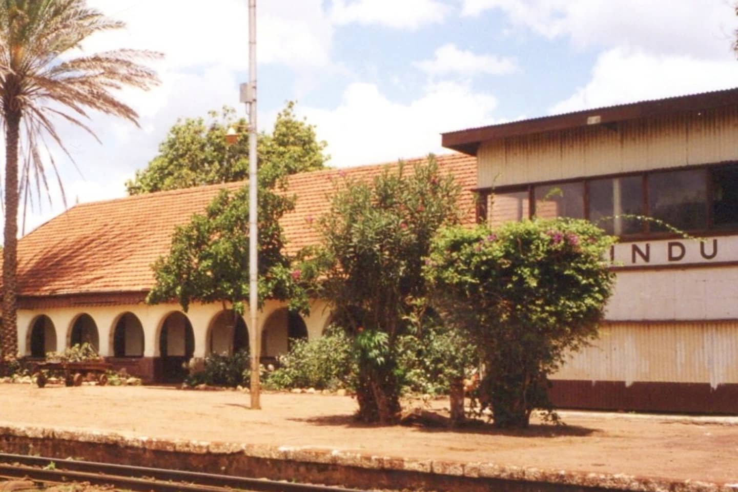 The Makindu station (including hotel) was a beautiful building, built c.1920. This photo was taken in 2001 by Terry Barton.
Makindu town is named after the Kamba word for the Wild Date Palm tree which is prevalent in the area (You can spot one next to the station in the pictures above)
By the time I was doing this project in 2015, Makindu station had already been demolished to pave way for the SGR. I personally never got a chance to see it but I'm grateful for all the photos people have shared with me.
Photo Courtesy of Terry Barton.
#Kenya #Makindu #Railways #History #EastAfrica